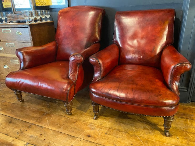a rare pair of howard & sons antique leather club arm chairs