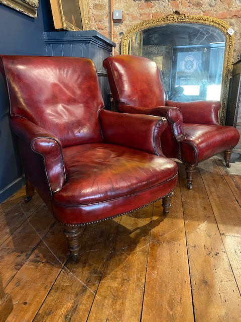 a rare pair of howard & sons antique leather club arm chairs