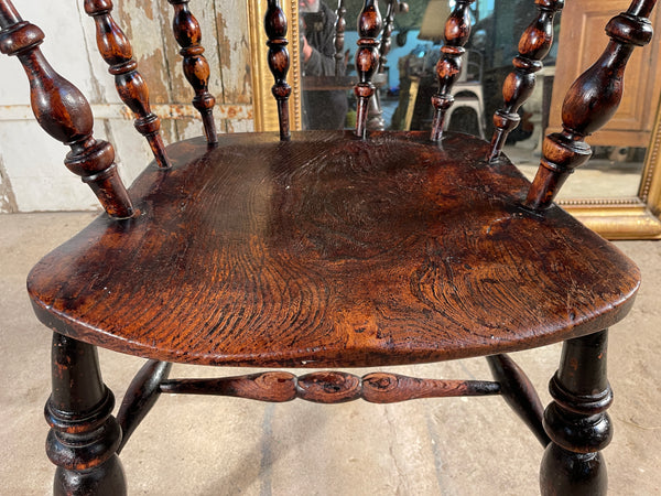 a beautiful early antique elm elbow captains chair