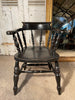a beautiful early antique ebonised elbow captains chair