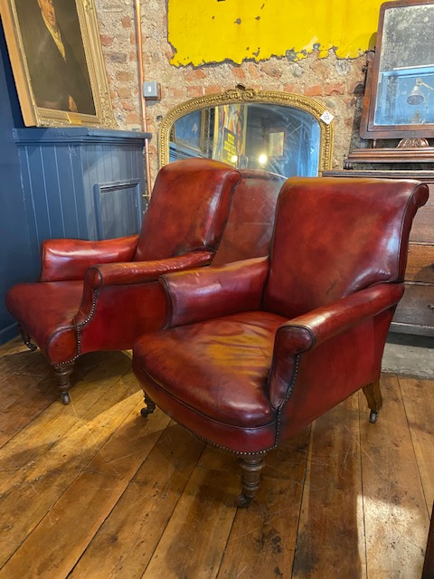 a rare pair of howard & sons antique leather club arm chairs