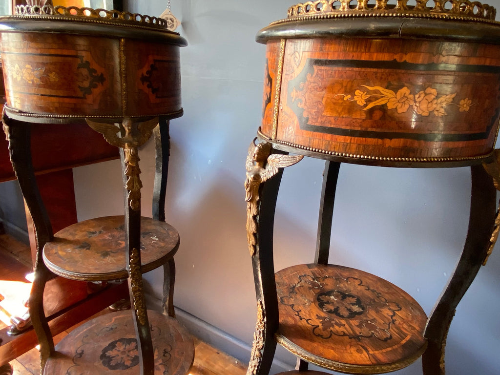 a stunning pair of french marquetry tables with gilt metal ormolu angel mounts