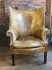 an exceptional georgian style barrel back leather library/fireside arm chair of generous proportions