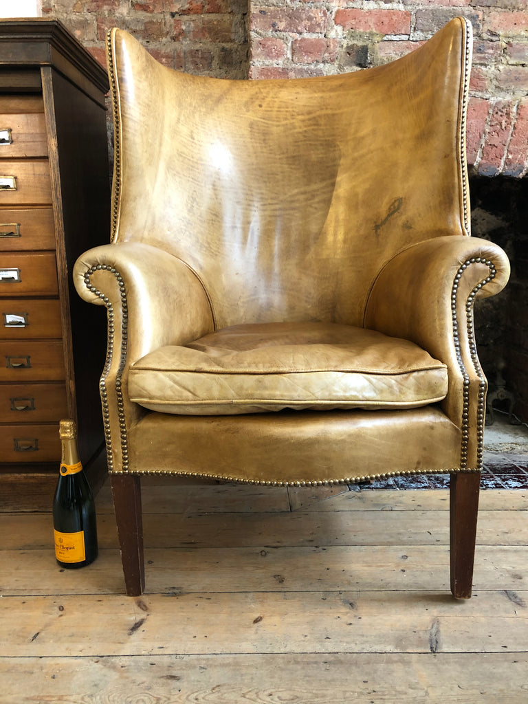 an exceptional georgian style barrel back leather library/fireside arm chair of generous proportions