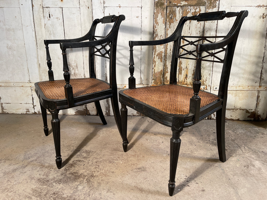 a pair of antique howard and sons georgian cane elbow chairs