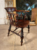 a beautiful early antique elm elbow captains chair